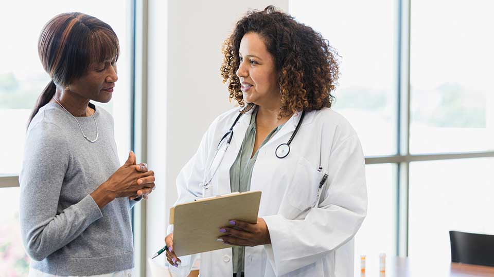 Doctor talking with patient