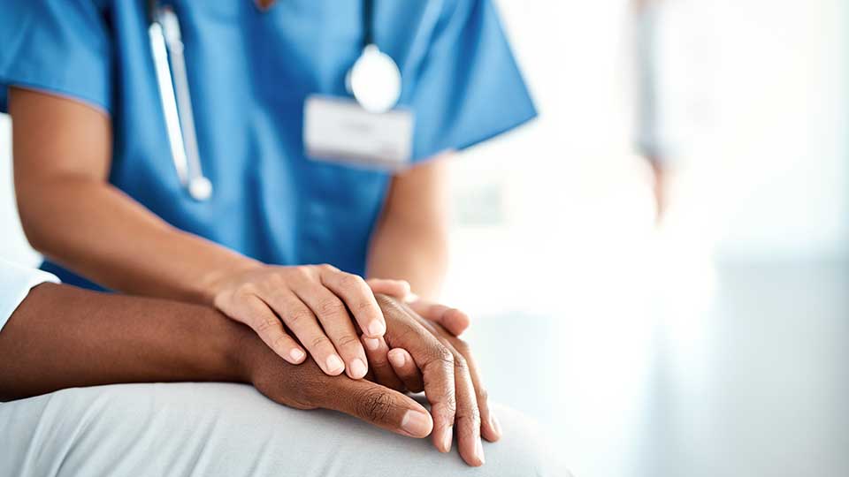 nurse holding hand