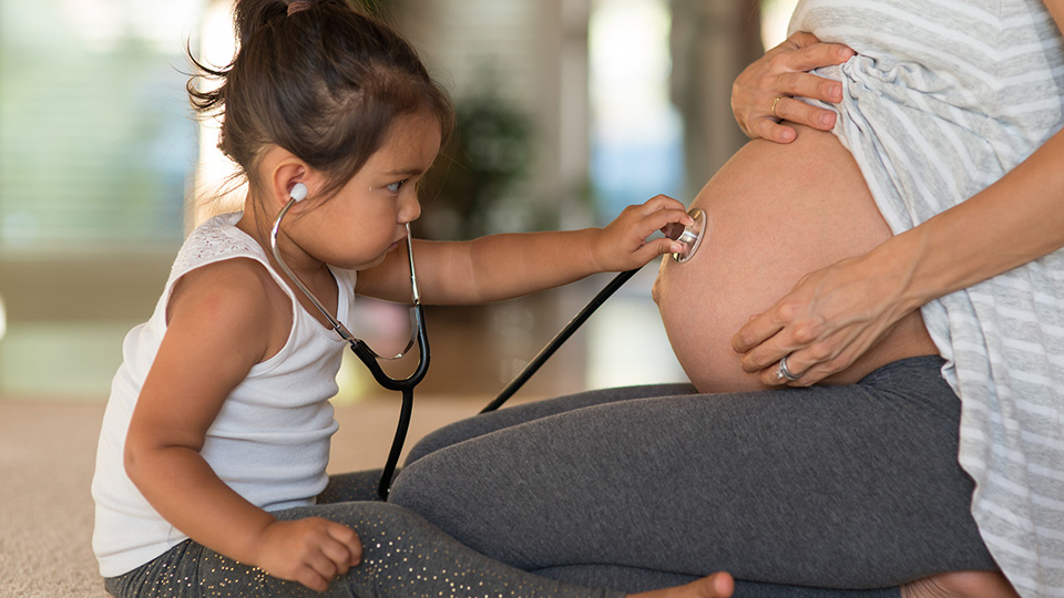 Daughter with pregnant mother