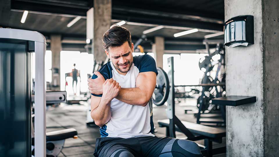 Man with sore shoulder need an orthopedist
