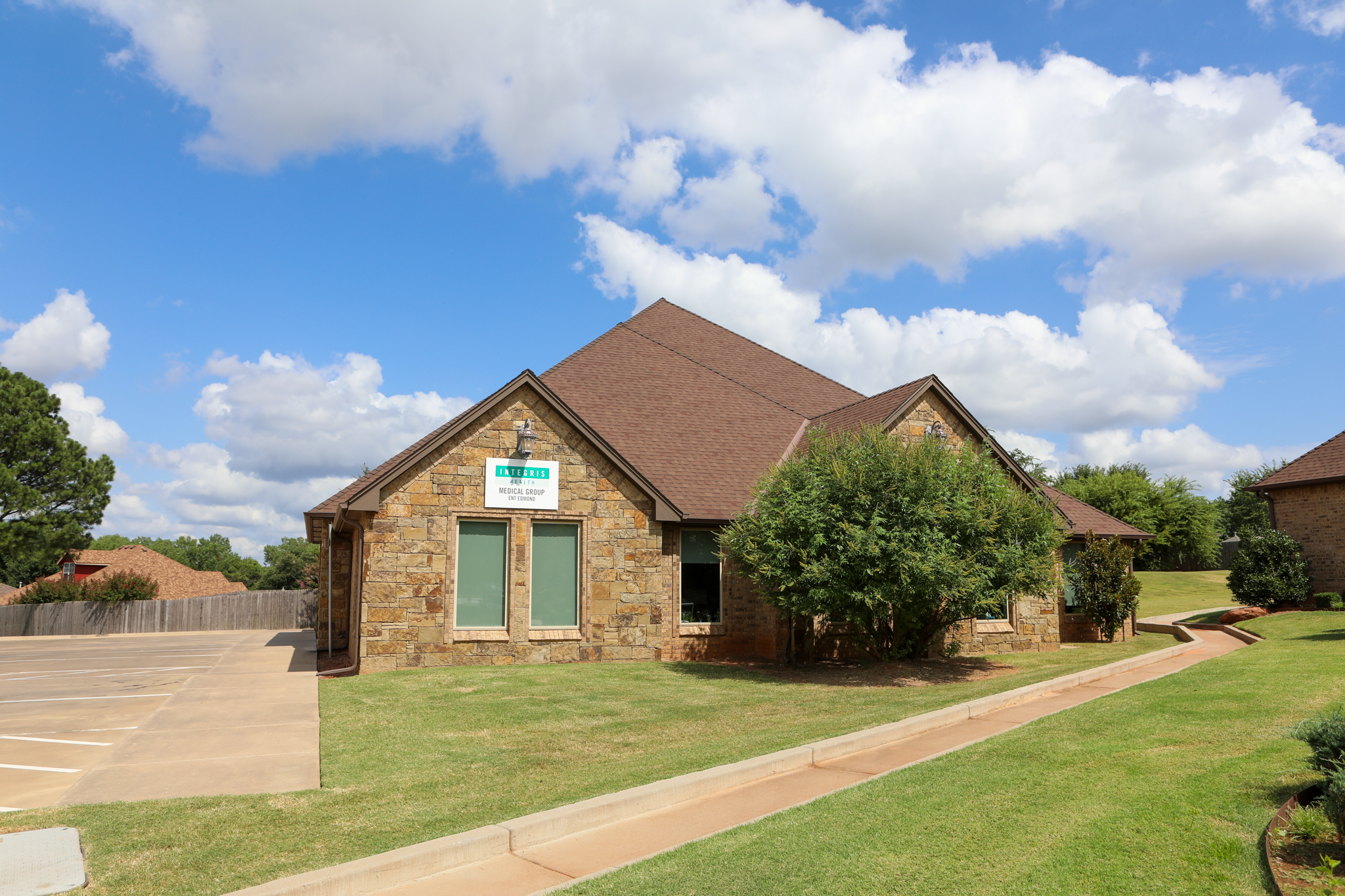 Exterior shot of brick building with INTEGRIS Health Medical Group ENT sign on the front
