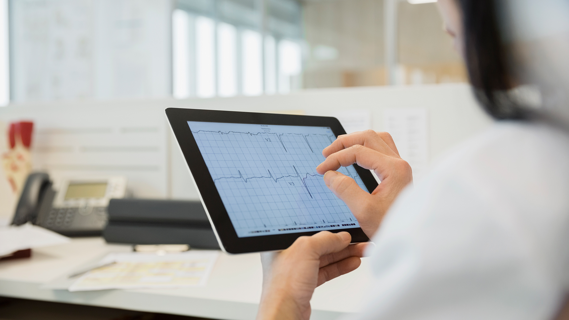 nurse looking at chart