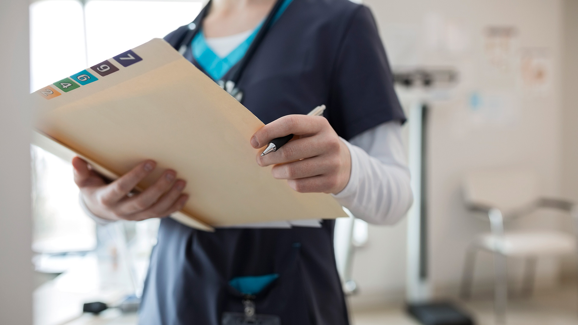 nurse with patient care folder