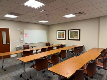 Classroom with three long table and chairs