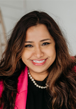 Pooja Singhal smiling and posing