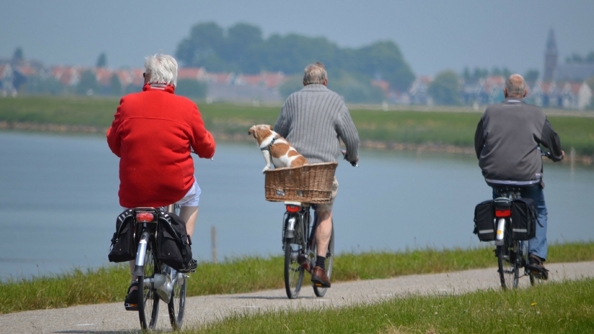 elderly people riding a bike