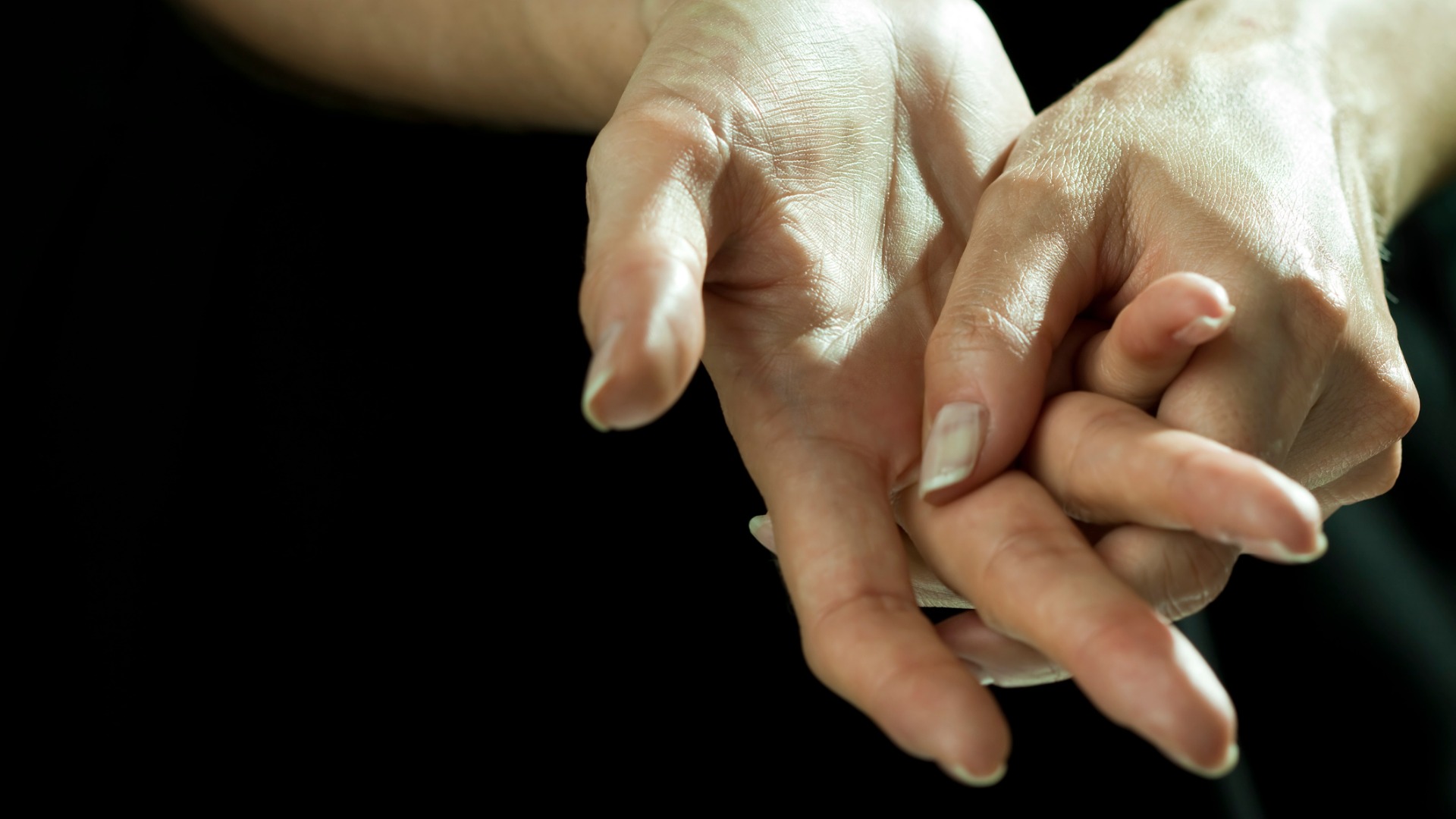 woman massaging sore wrist