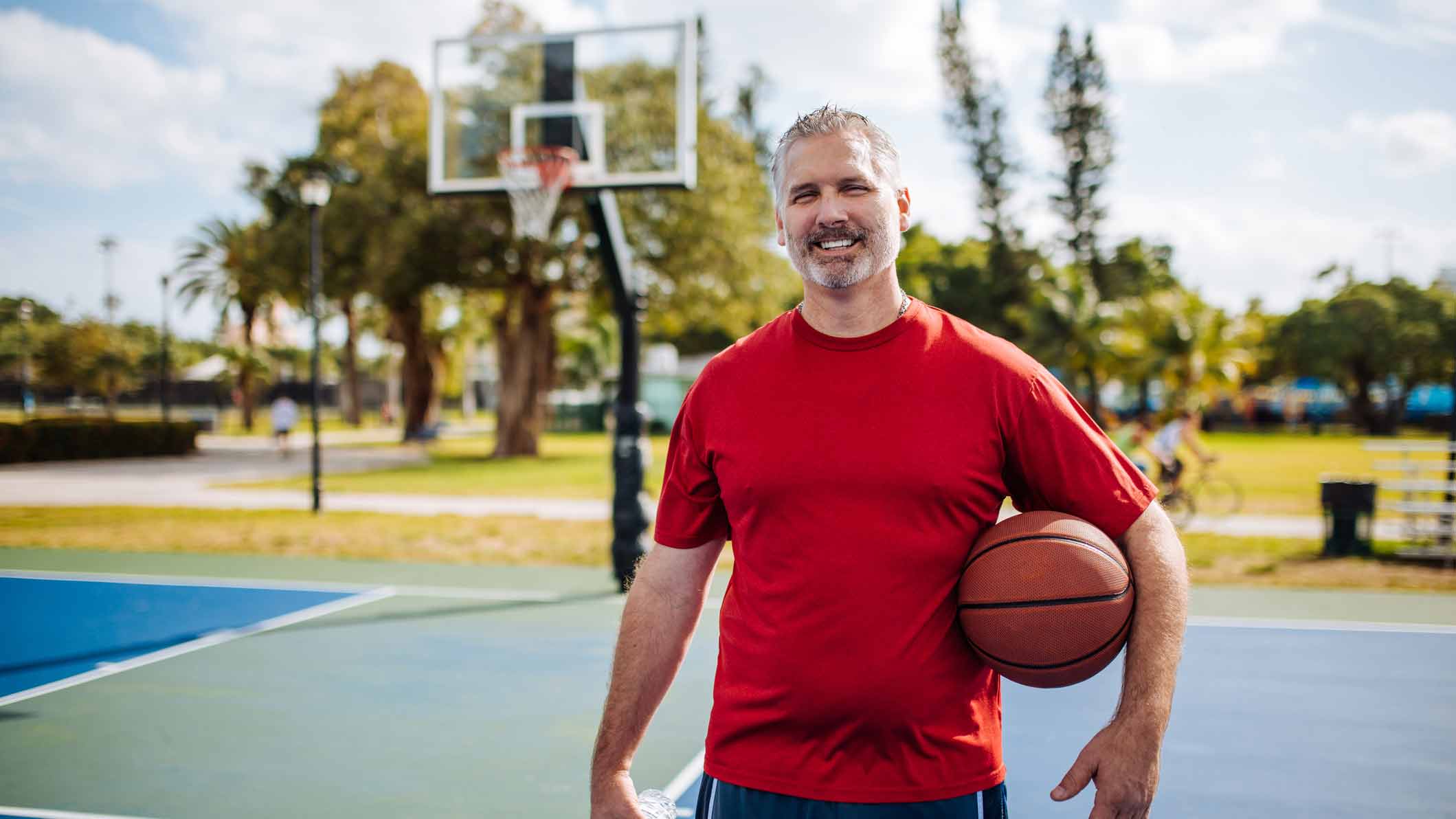 man holding basketball