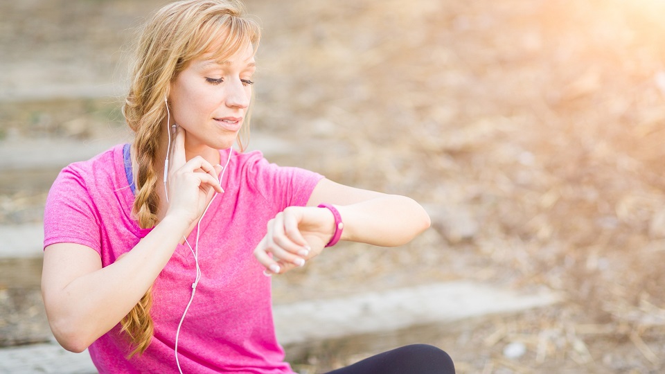 woman checking her heart rate