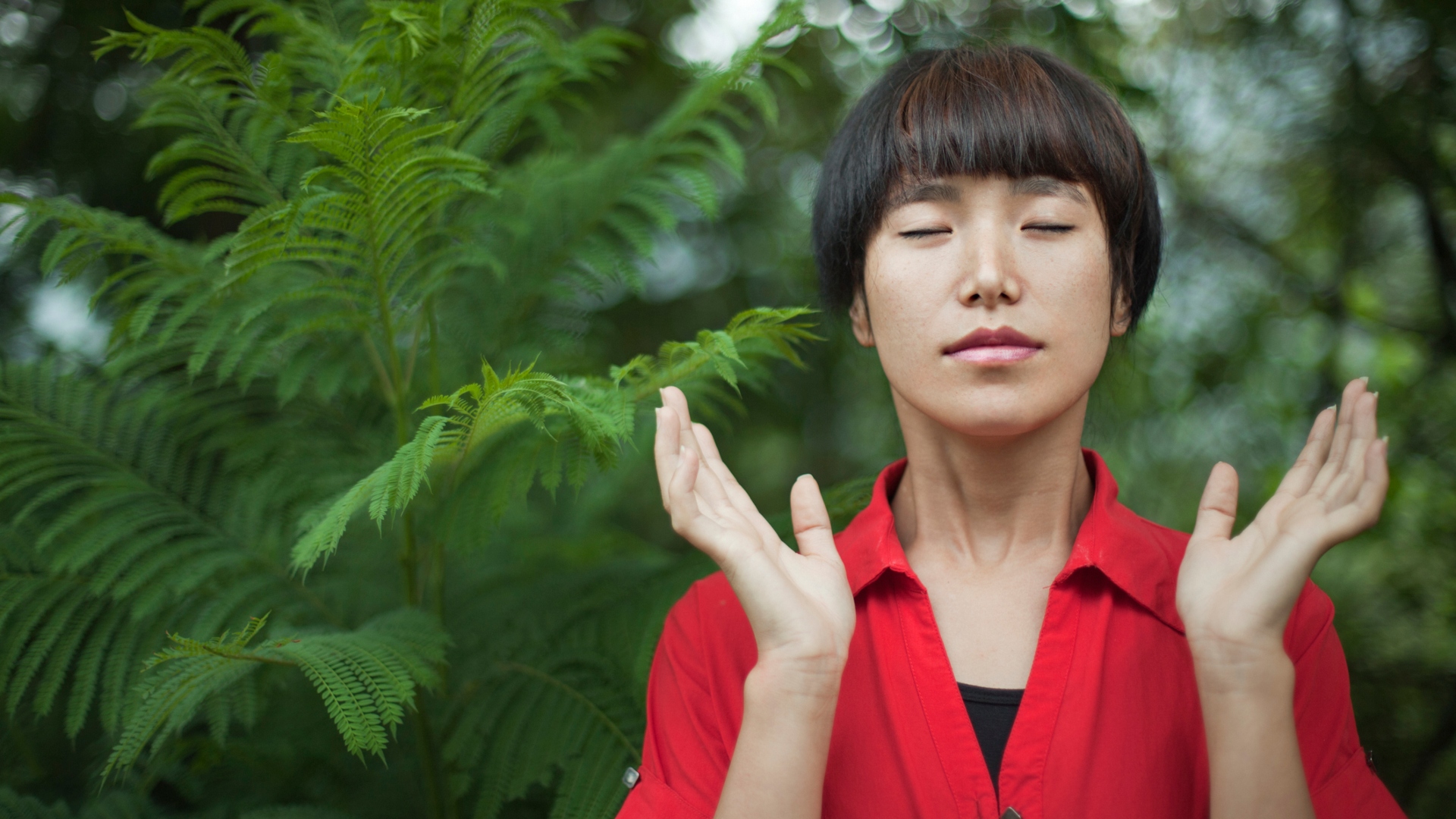 woman breathing deeply in nature