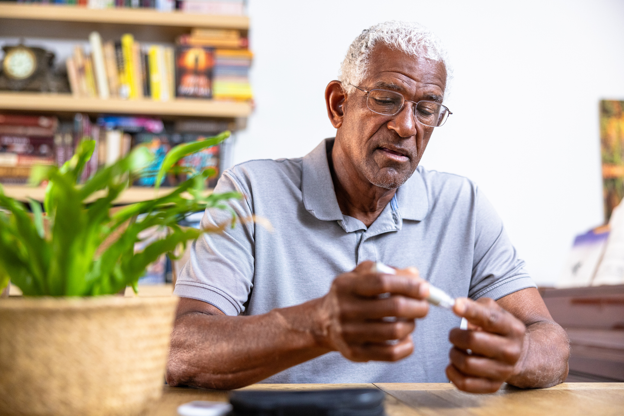 A man tests his blood sugar