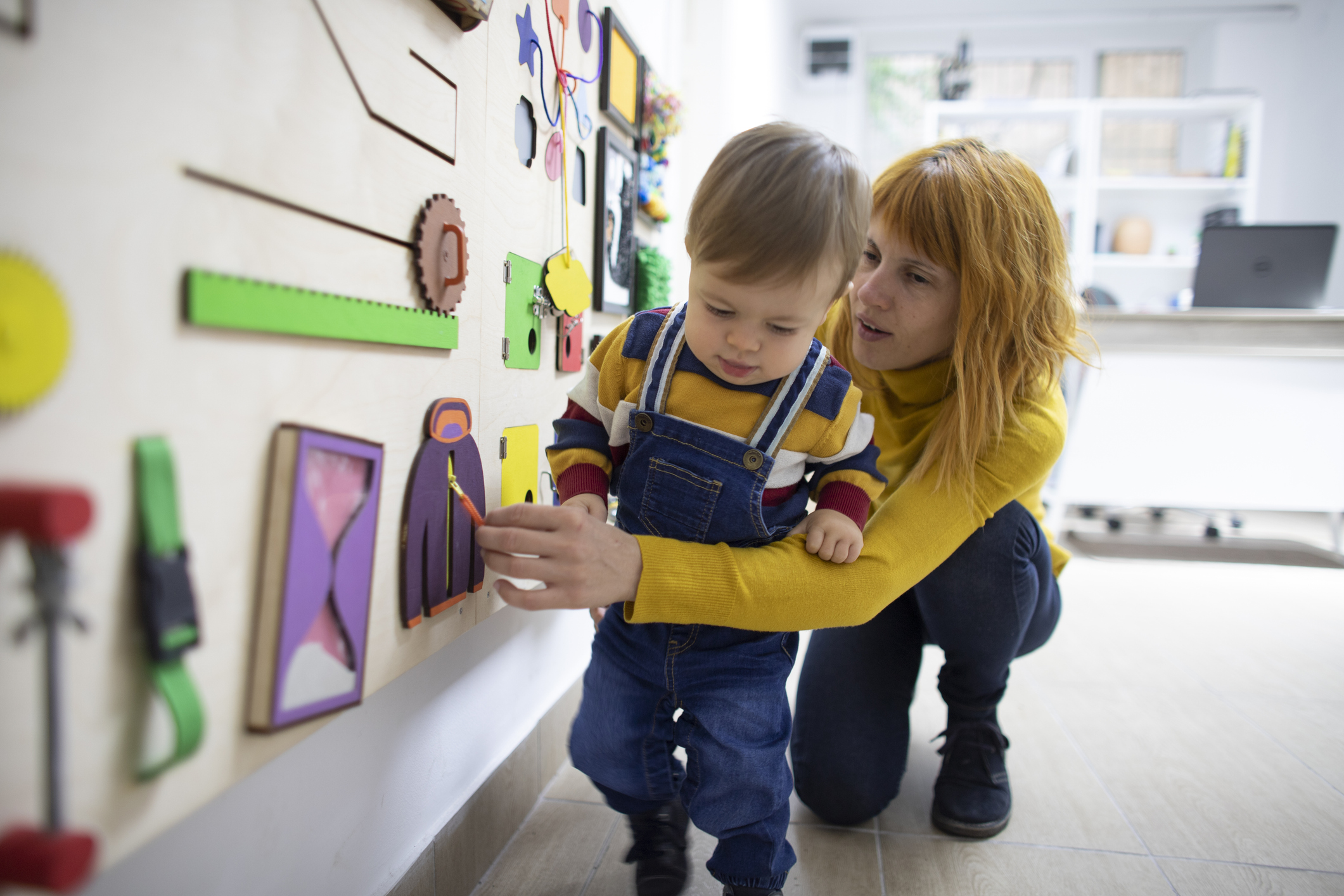 A woman and child paint together