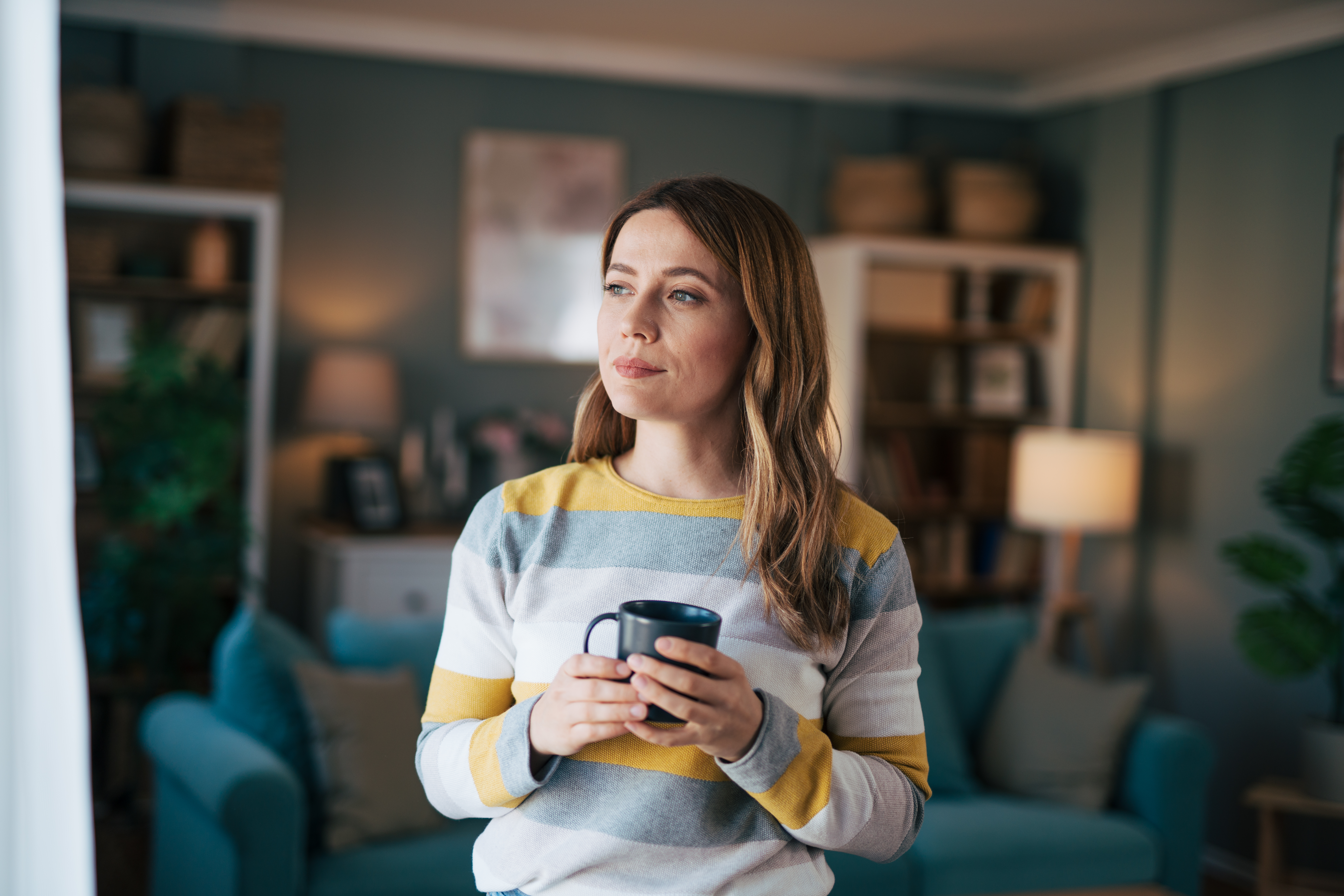 A woman holding a cup of tea