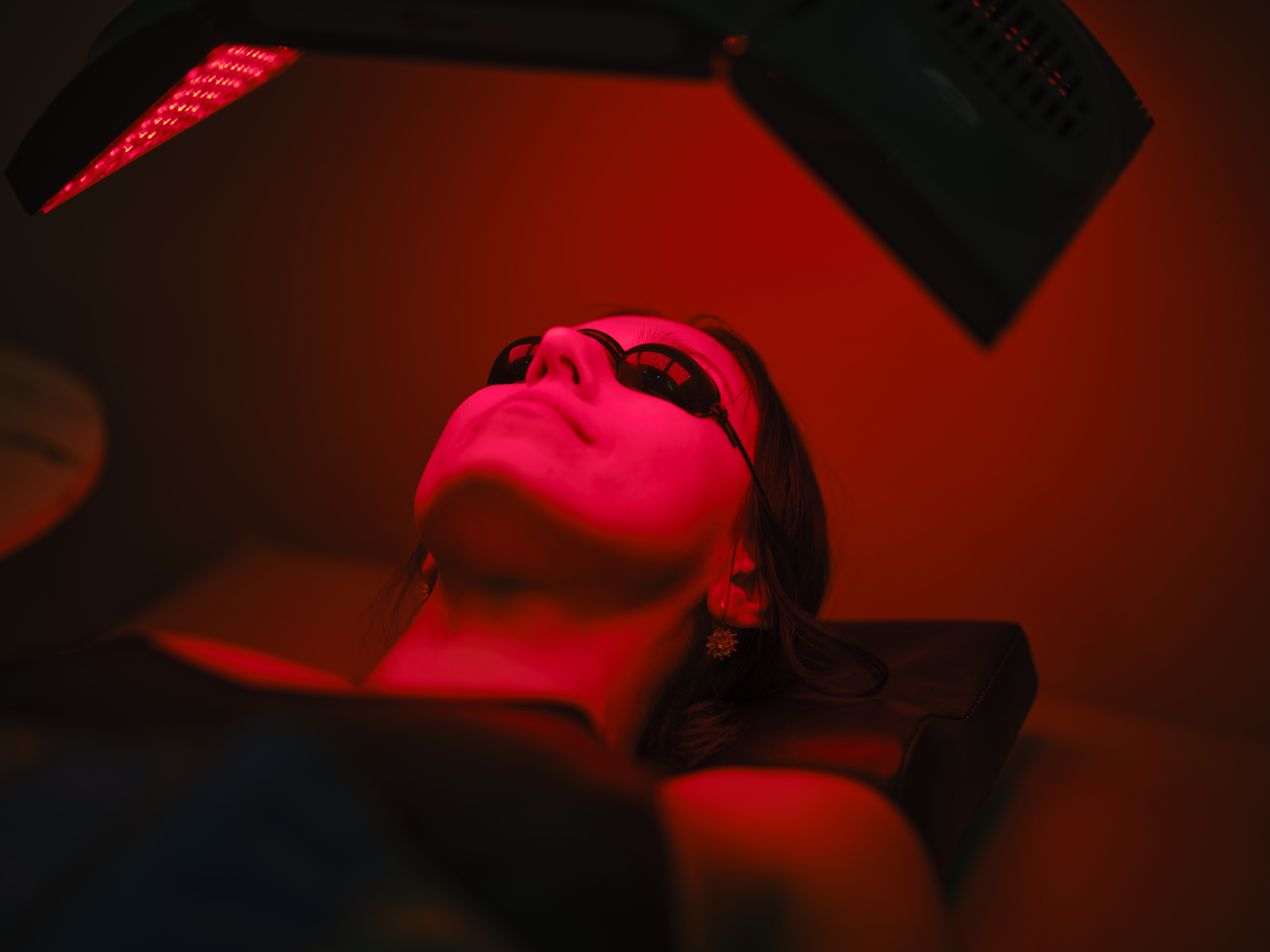 a woman receiving infrared light therapy