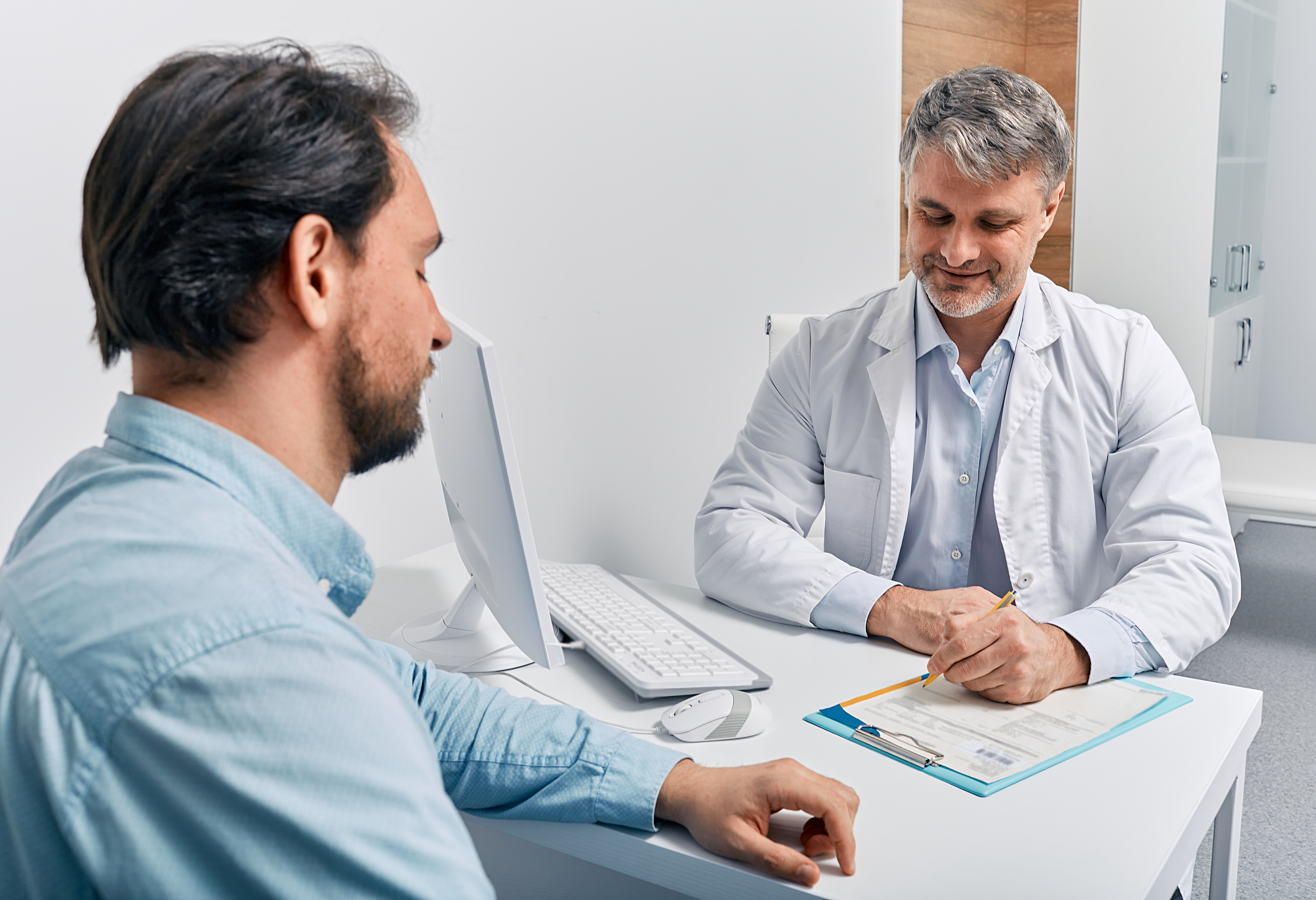 A man visits with his doctor