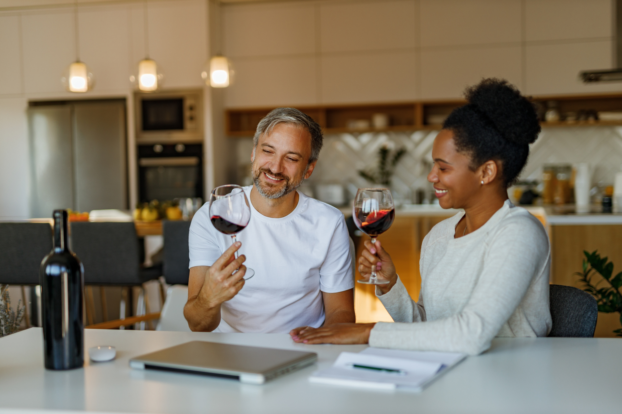 a couple enjoys a glass of wine