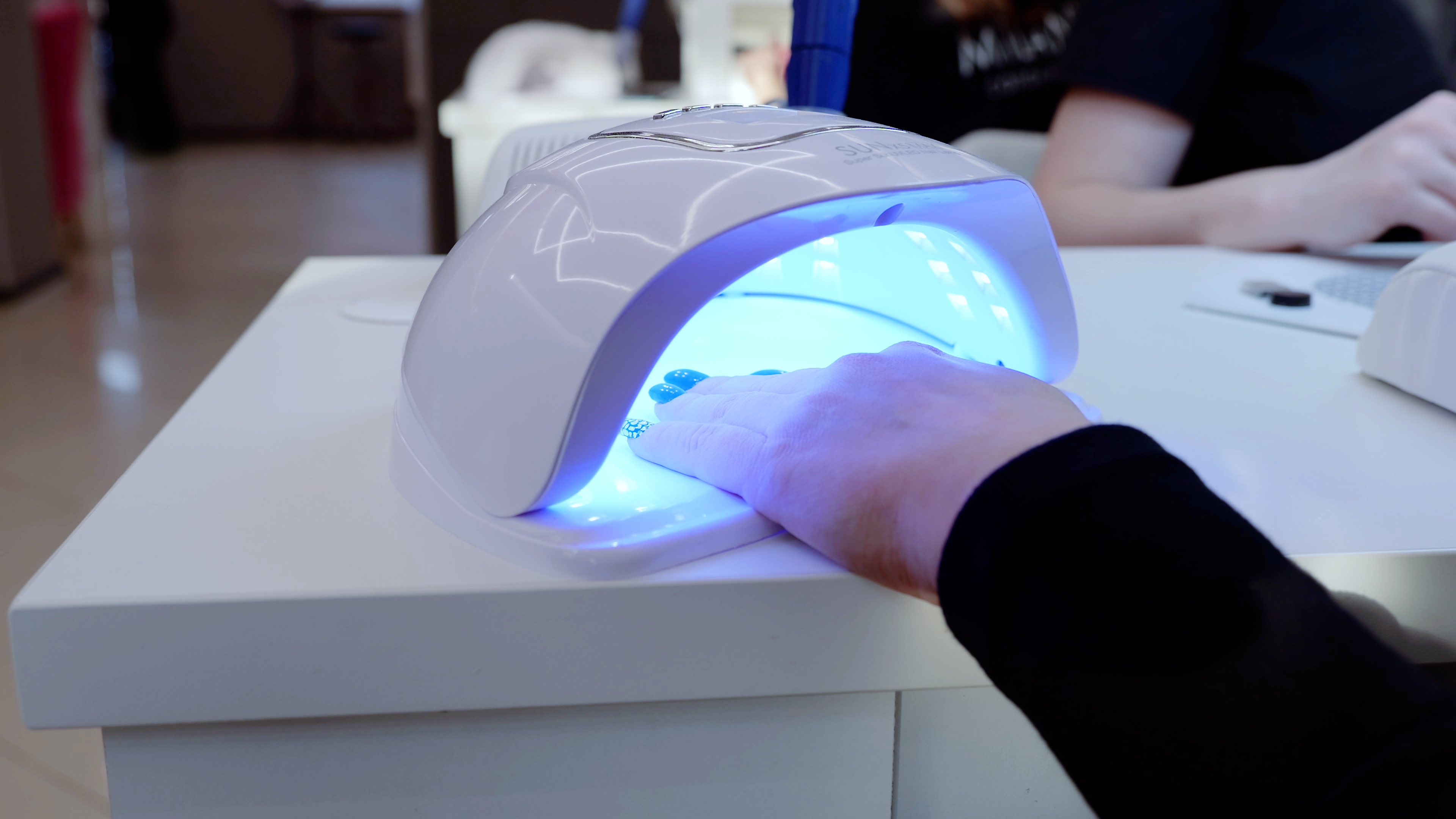 a hand is shown getting a manicure