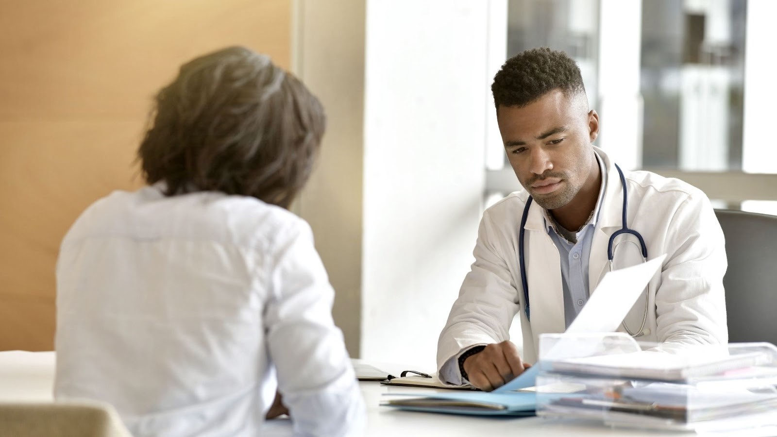 Woman Talking to Doctor about Preventative Healthcare