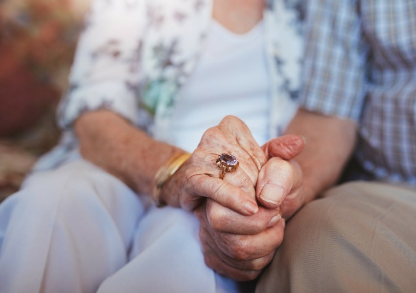 Elderly Couple Holding Hands