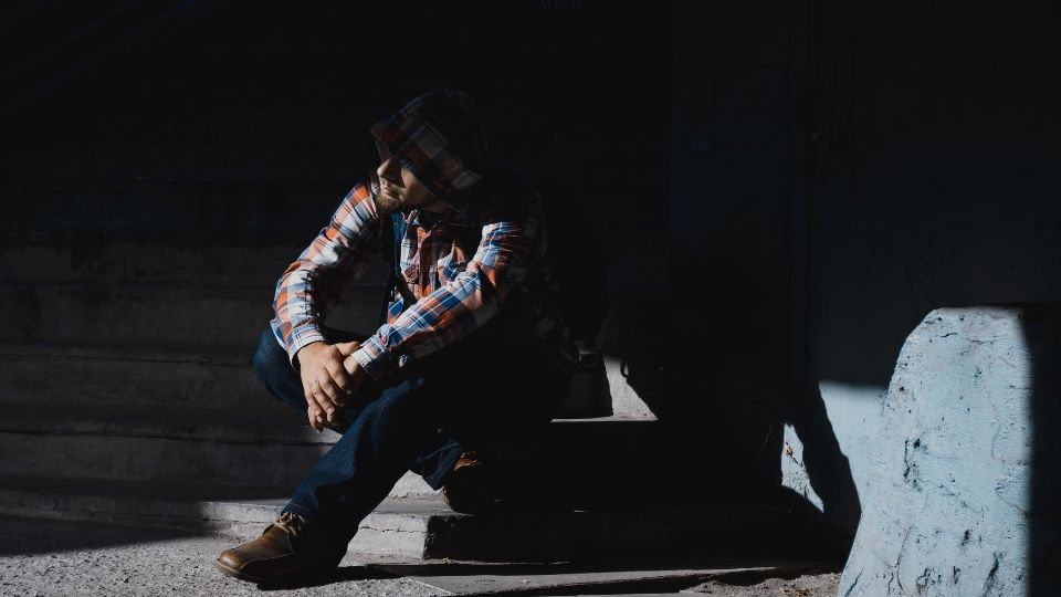 Man hiding in shadows
