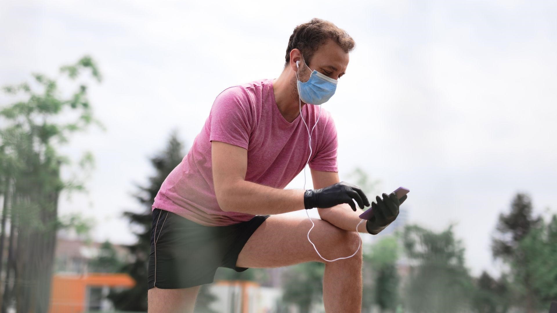 man wearing a mask while jogging