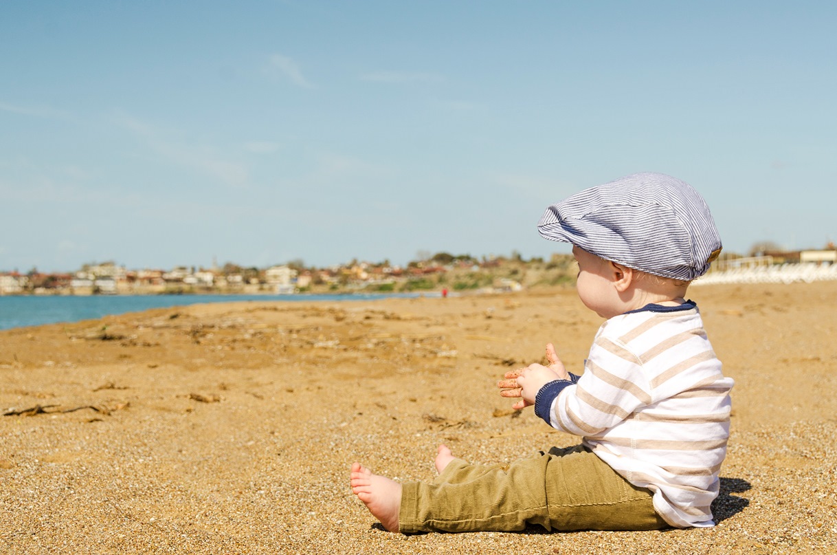 Baby sitting on a beach