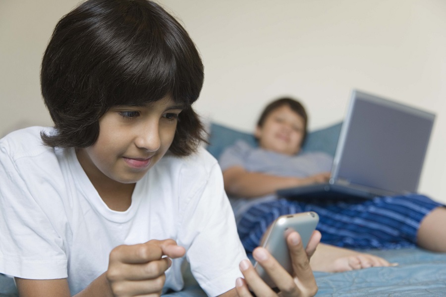 boys on laptop smartphone