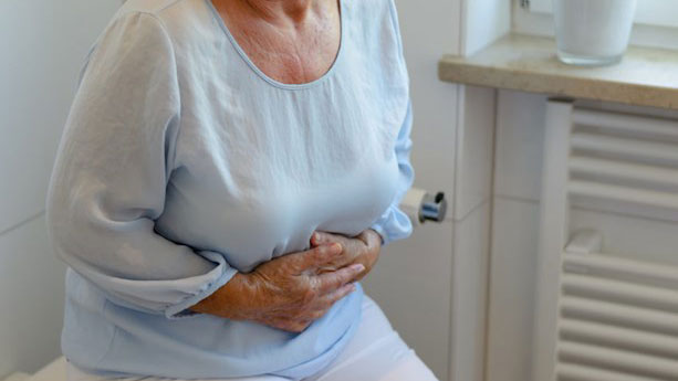 Woman holding stomach