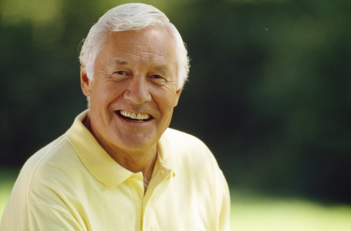 senior man wearing yellow shirt