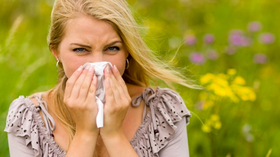 Woman Sneezing With Flowers