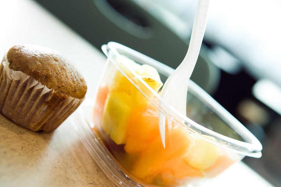 Cup of fruit and muffin