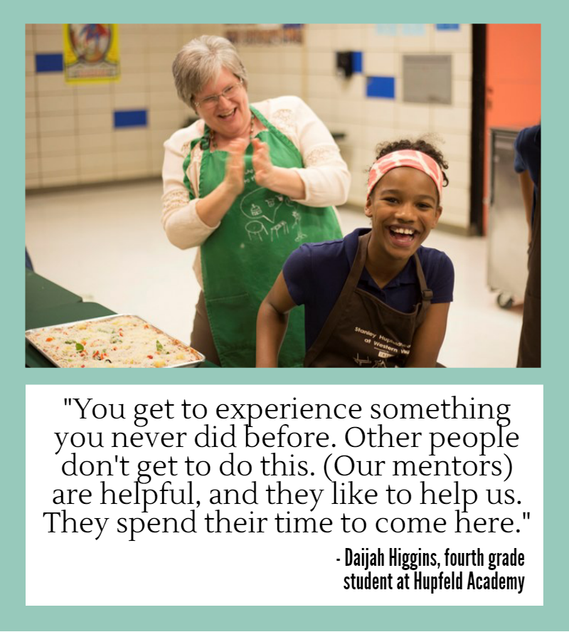 Young student laughing with adult mentor. Daijah Higgins, a fourth grade student at Hupfeld Academy:, says "You get to experience something you never did before. Other people don't get to do this. Our mentors are helpful, and they like to help us. They spend their time to come here."